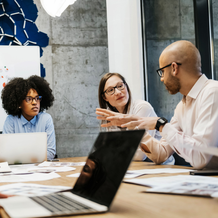 three corporate employees having a discussion